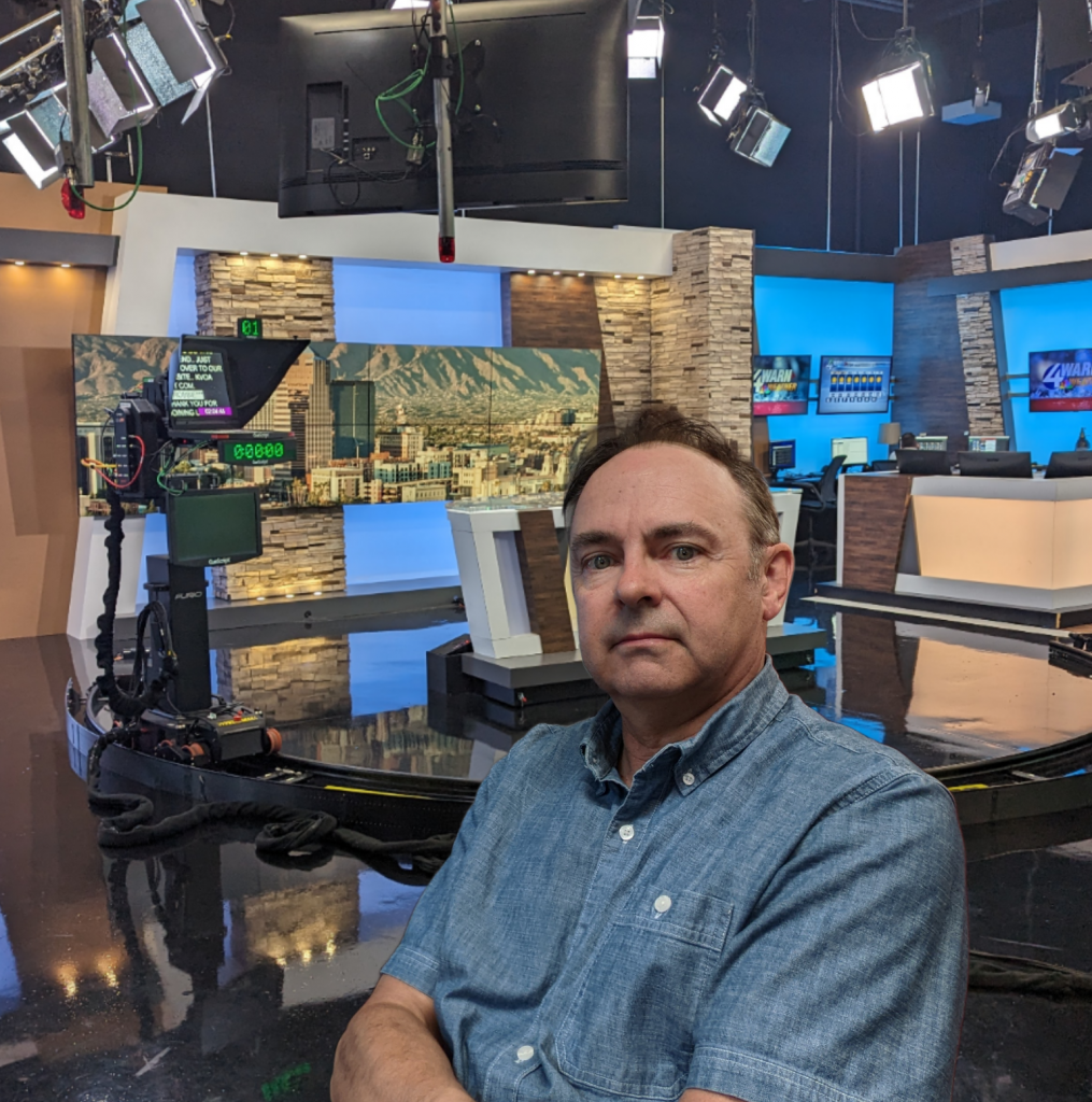 A man inside of a television studio.